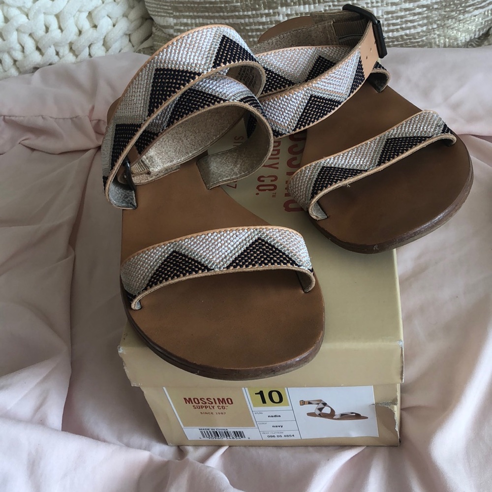 Used sandals with tribal-ish pattern.